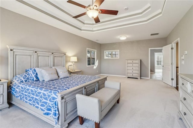 5365 Vendelay Ln, Cumming, GA 30040 - bedroom featuring a tray ceiling, light colored carpet, a ceiling fan, baseboards, and crown molding