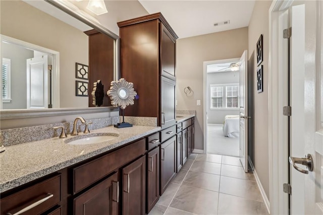 5365 Vendelay Ln, Cumming, GA 30040 - full bathroom featuring double vanity, a ceiling fan, tile patterned flooring, baseboards, and connected bathroom