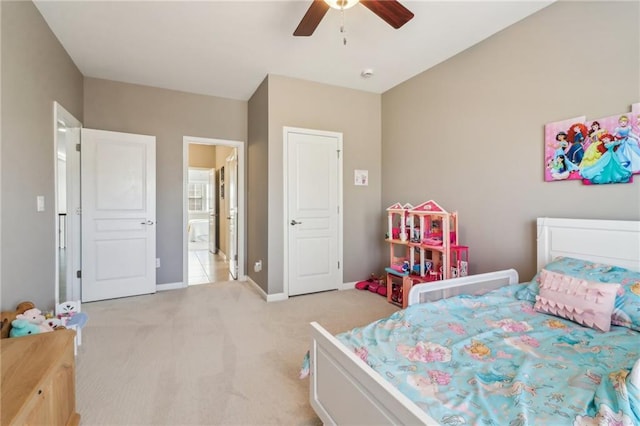 5365 Vendelay Ln, Cumming, GA 30040 - bedroom featuring light carpet, baseboards, a ceiling fan, and connected bathroom