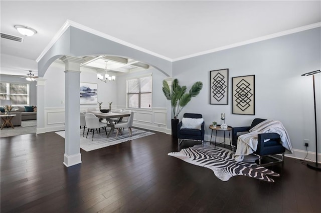 sitting room with arched walkways, coffered ceiling, visible vents, wood-type flooring, and ornate columns