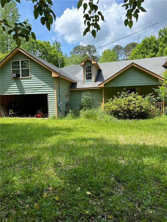 view of front of home with roof with shingles