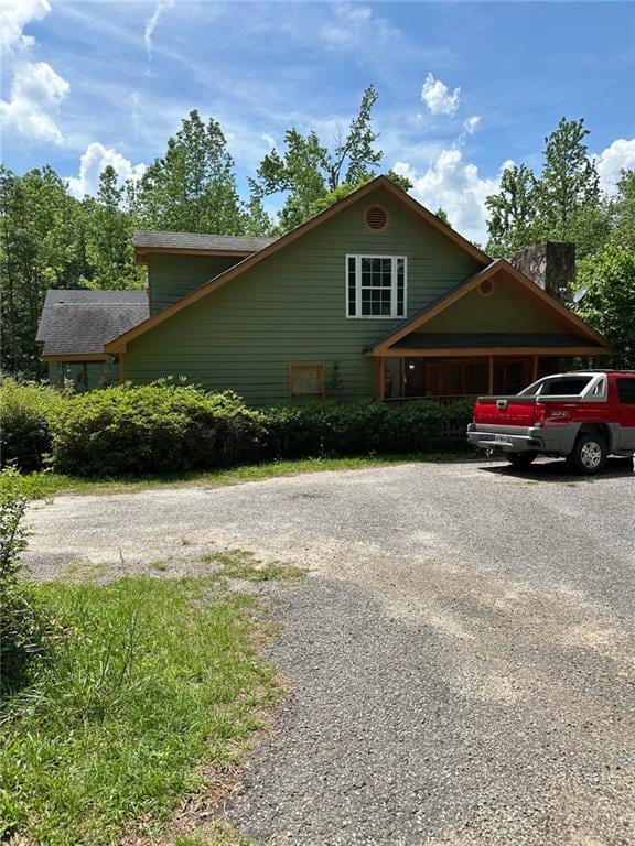 view of side of property with driveway