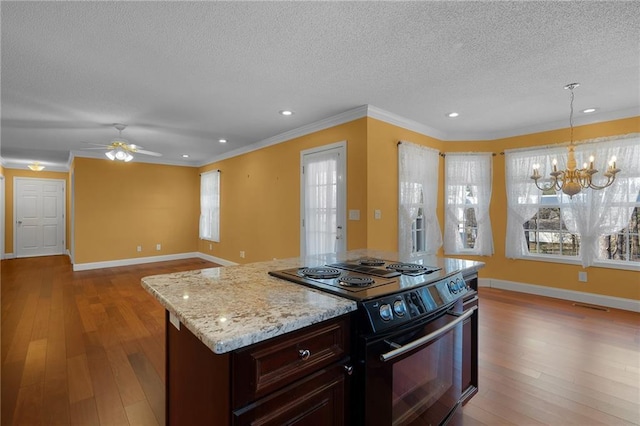 kitchen with light wood finished floors, crown molding, and black range with electric cooktop