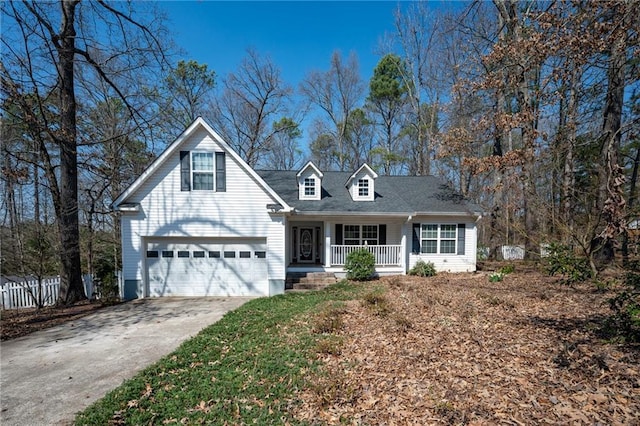 view of front of home featuring a porch and concrete driveway