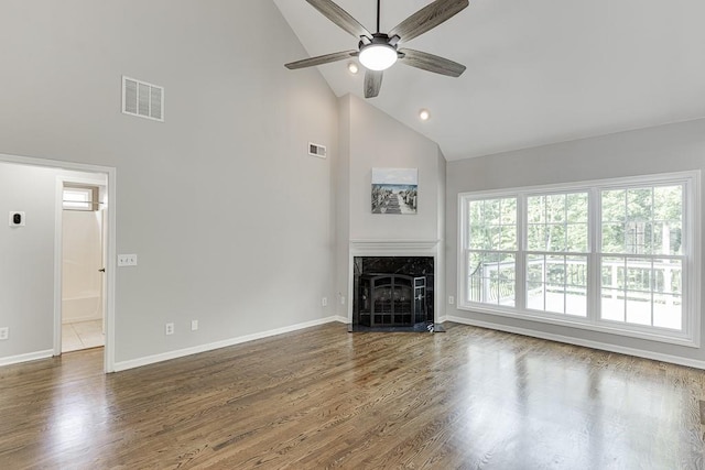 4690 Martins Crossing W Dr, Flowery Branch, GA 30542 - unfurnished living room featuring high vaulted ceiling, a ceiling fan, wood finished floors, a high end fireplace, and baseboards