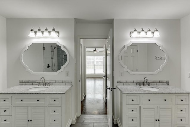 4690 Martins Crossing W Dr, Flowery Branch, GA 30542 - full bath with two vanities, ceiling fan, and a shower