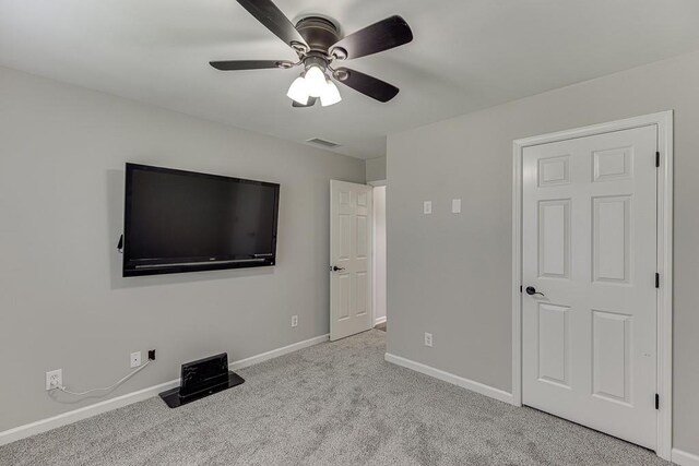 4690 Martins Crossing W Dr, Flowery Branch, GA 30542 - unfurnished bedroom with baseboards, carpet flooring, and ceiling fan