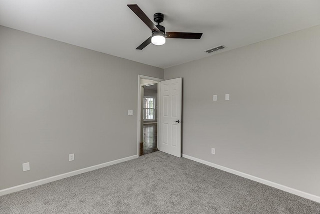 4690 Martins Crossing W Dr, Flowery Branch, GA 30542 - unfurnished bedroom with carpet floors, baseboards, and ceiling fan