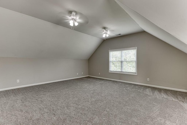 4690 Martins Crossing W Dr, Flowery Branch, GA 30542 - additional living space with a ceiling fan, carpet flooring, baseboards, and vaulted ceiling