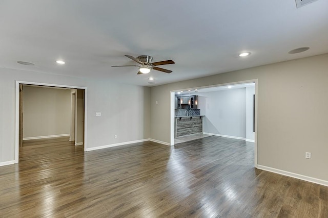 4690 Martins Crossing W Dr, Flowery Branch, GA 30542 - spare room featuring ceiling fan, baseboards, dark wood-style floors, and recessed lighting