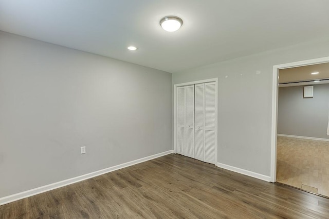 4690 Martins Crossing W Dr, Flowery Branch, GA 30542 - unfurnished bedroom with wood finished floors, baseboards, and recessed lighting