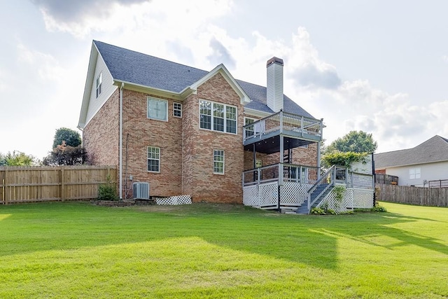 4690 Martins Crossing W Dr, Flowery Branch, GA 30542 - rear view of house featuring brick siding, a chimney, a wooden deck, stairway, and roof with shingles