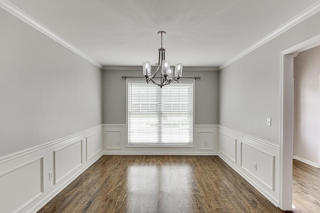 4690 Martins Crossing W Dr, Flowery Branch, GA 30542 - unfurnished room featuring a chandelier, wainscoting, dark wood-type flooring, a decorative wall, and crown molding