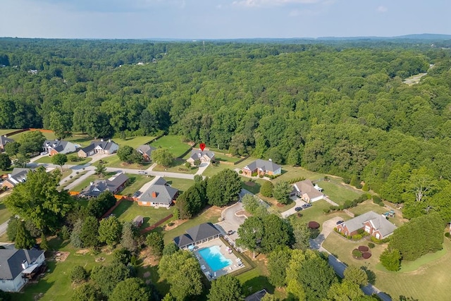 4690 Martins Crossing W Dr, Flowery Branch, GA 30542 - aerial view of property and surrounding area with a heavily wooded area and nearby suburban area