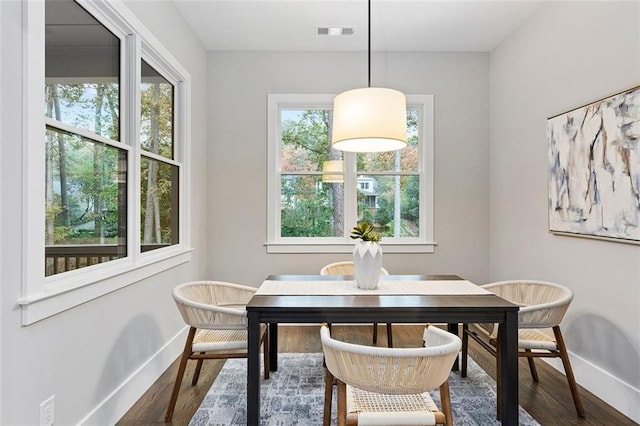 660 Timm Valley Rd NE, Atlanta, GA 30305 - dining room with baseboards, visible vents, and wood finished floors