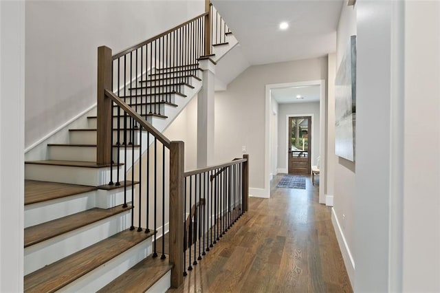 staircase featuring hardwood / wood-style flooring