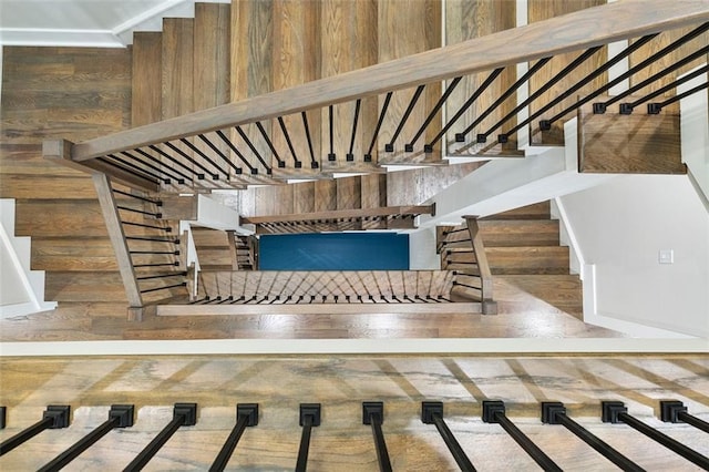 stairway featuring wood-type flooring