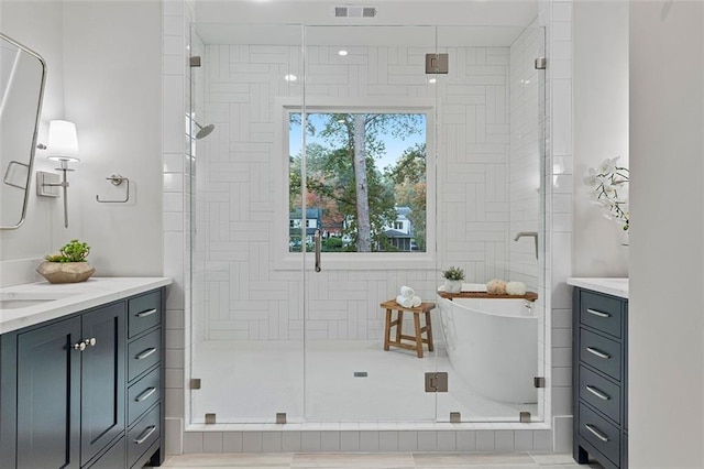 660 Timm Valley Rd NE, Atlanta, GA 30305 - bathroom featuring a stall shower, a soaking tub, visible vents, and vanity