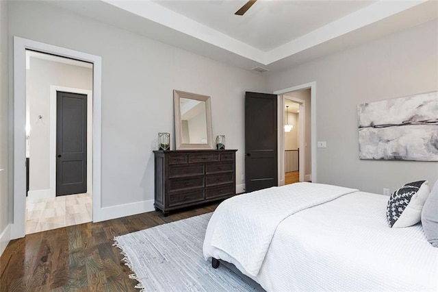 bedroom featuring ceiling fan and dark hardwood / wood-style floors