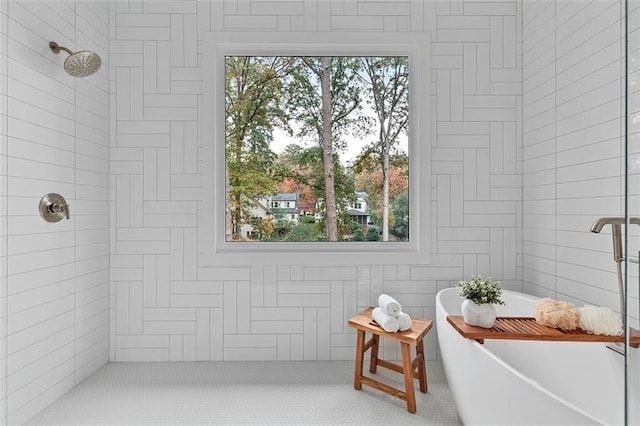 bathroom featuring separate shower and tub