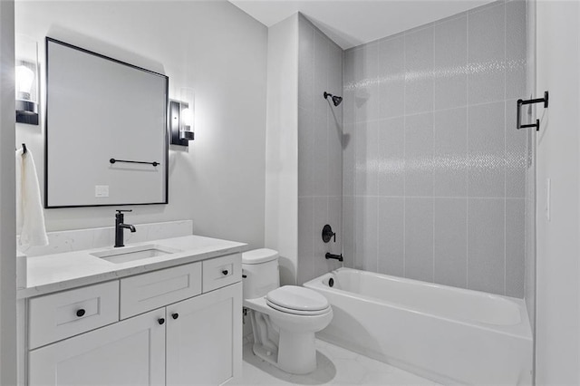 full bathroom with vanity, toilet, and tiled shower / bath combo