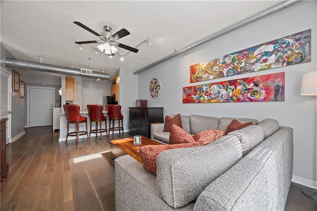 800 Peachtree St NE Unit 1504, Atlanta, GA 30308 - living area featuring a ceiling fan, hardwood / wood-style floors, and baseboards
