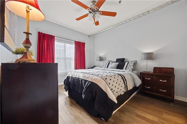 800 Peachtree St NE Unit 1504, Atlanta, GA 30308 - bedroom with wood finished floors, baseboards, and ceiling fan