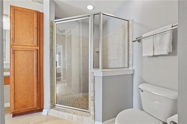 800 Peachtree St NE Unit 1504, Atlanta, GA 30308 - full bathroom featuring toilet, a shower stall, and tile patterned floors