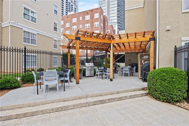 800 Peachtree St NE Unit 1504, Atlanta, GA 30308 - view of patio / terrace with a pergola and outdoor dining area