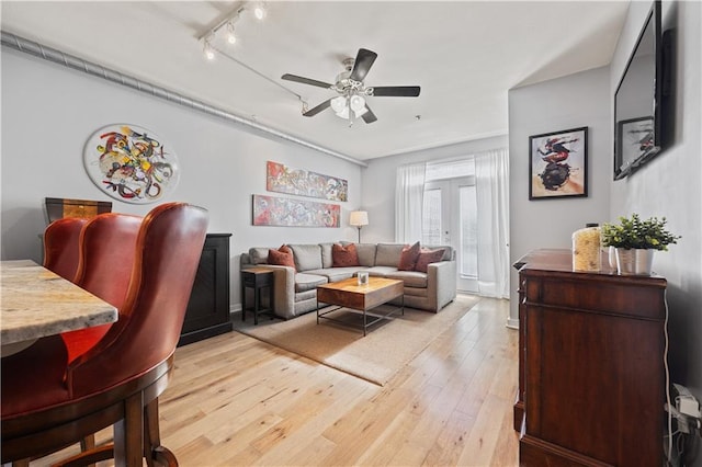800 Peachtree St NE Unit 1504, Atlanta, GA 30308 - living area with rail lighting, light wood-style flooring, a ceiling fan, and french doors