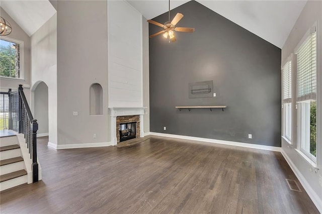 420 Gold Xing, Canton, GA 30114 - unfurnished living room featuring high vaulted ceiling, stairs, a fireplace, wood finished floors, and ceiling fan