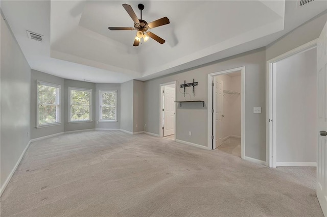 420 Gold Xing, Canton, GA 30114 - unfurnished bedroom with a raised ceiling, carpet floors, a spacious closet, and a ceiling fan