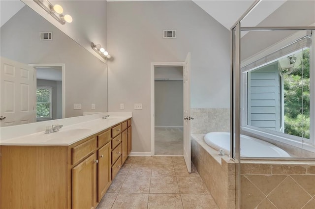 420 Gold Xing, Canton, GA 30114 - full bathroom featuring double vanity, a bath, lofted ceiling, and tile patterned flooring