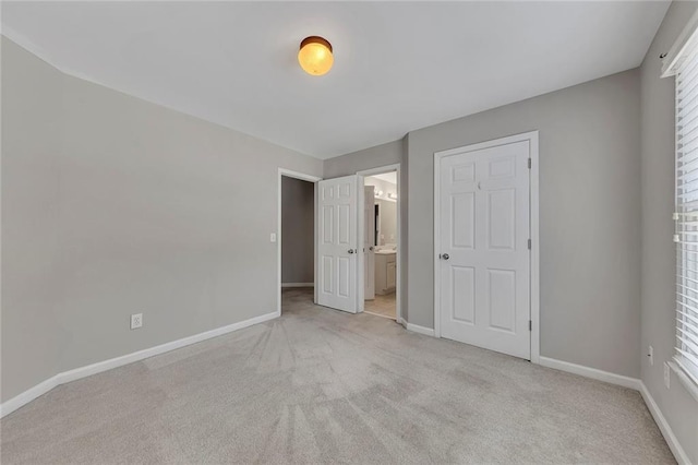 420 Gold Xing, Canton, GA 30114 - unfurnished bedroom featuring light carpet, ensuite bath, and multiple windows