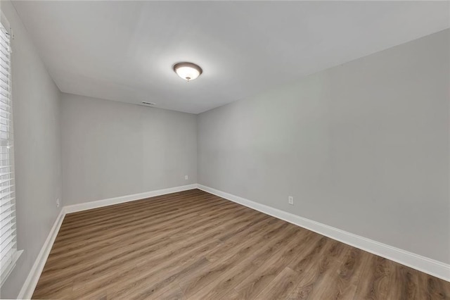 420 Gold Xing, Canton, GA 30114 - spare room featuring wood finished floors and plenty of natural light