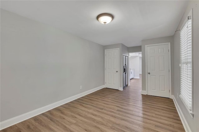 420 Gold Xing, Canton, GA 30114 - unfurnished bedroom featuring light wood finished floors