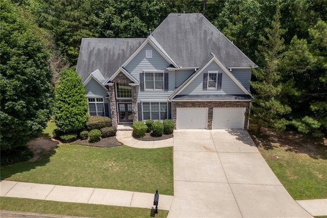 420 Gold Xing, Canton, GA 30114 - craftsman-style house featuring concrete driveway, an attached garage, a front yard, and stone siding