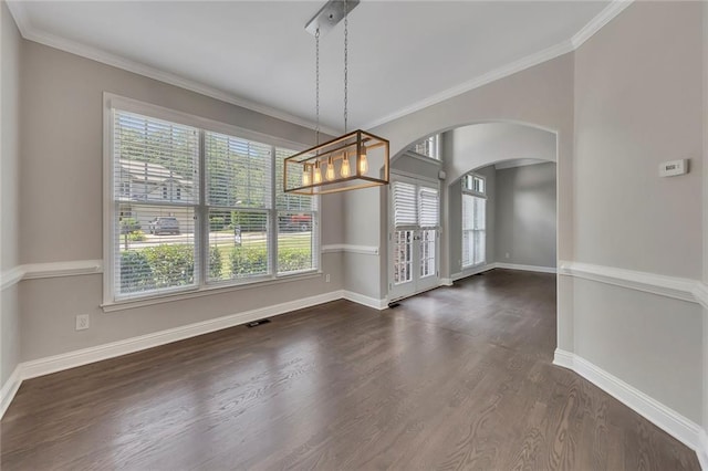 420 Gold Xing, Canton, GA 30114 - unfurnished dining area with arched walkways, plenty of natural light, dark wood-style floors, and crown molding