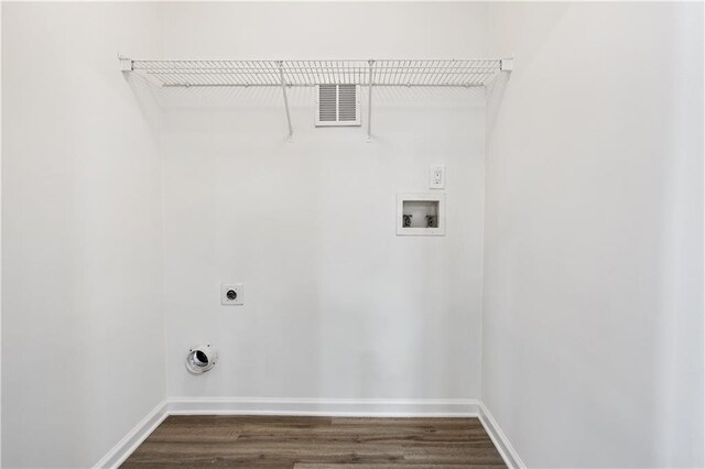 laundry room featuring washer hookup, dark wood-type flooring, and hookup for an electric dryer