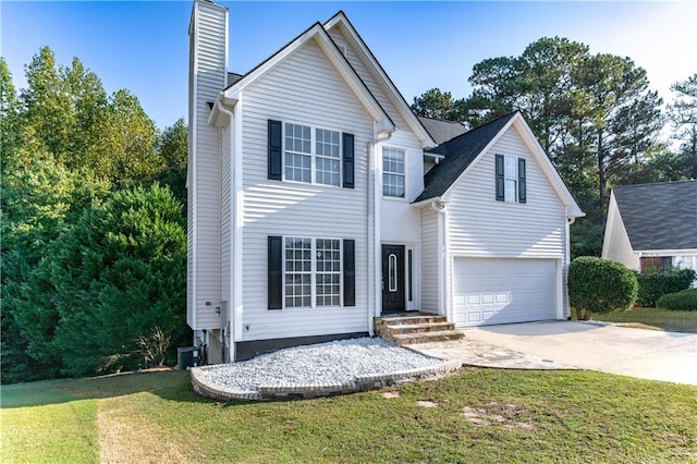 view of front of home featuring a garage and a front yard