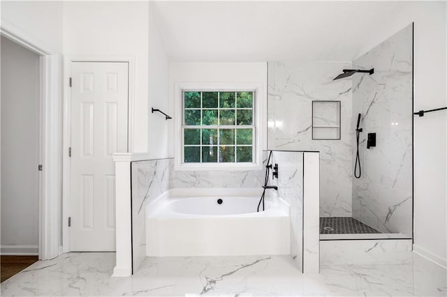 bathroom featuring separate shower and tub