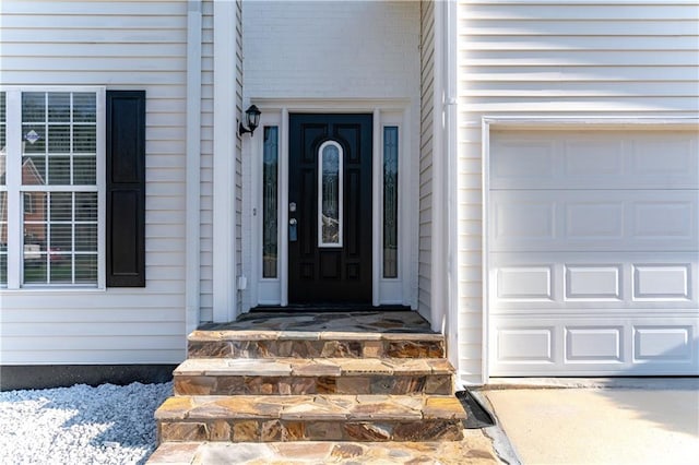 doorway to property featuring a garage