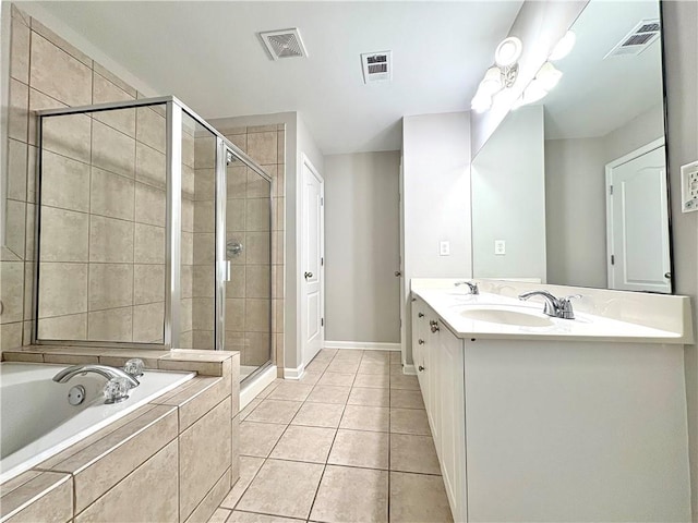 full bathroom featuring visible vents, a garden tub, a stall shower, and a sink