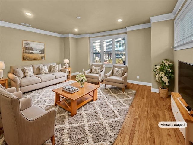 living area featuring recessed lighting, baseboards, wood finished floors, and crown molding