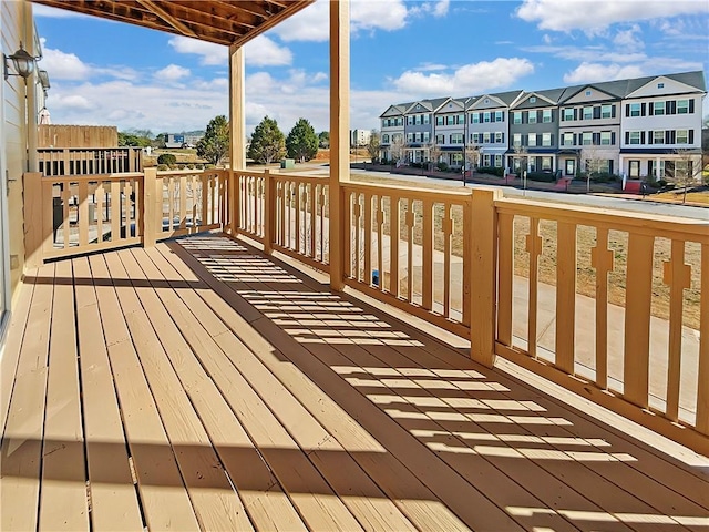 wooden deck with a residential view