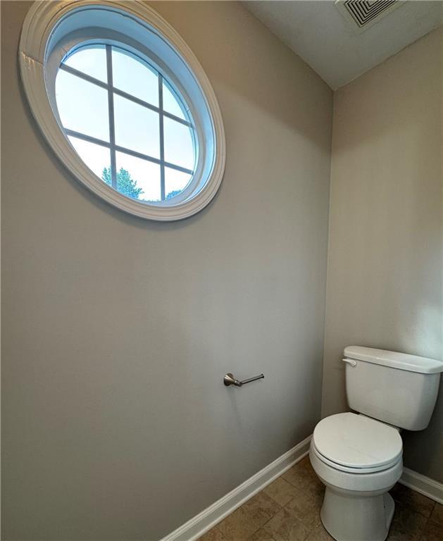 1415 Stoney Field Pl, Lawrenceville, GA 30043 - bathroom with baseboards and toilet