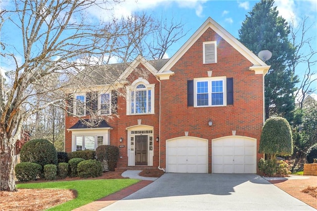 view of front facade featuring a garage, driveway, and brick siding