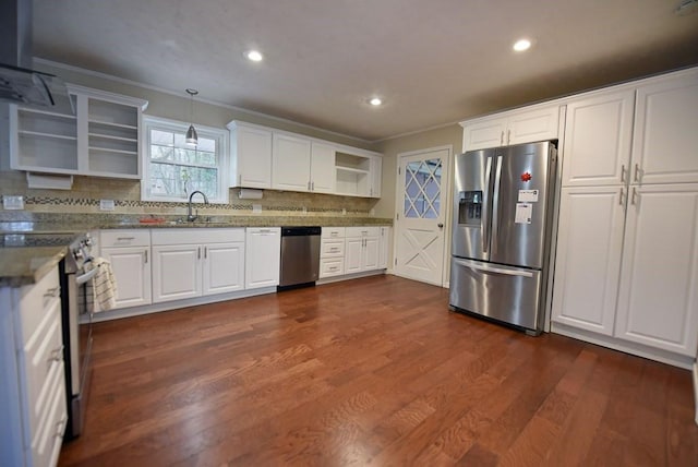 kitchen featuring dark hardwood / wood-style flooring, pendant lighting, white cabinets, and stainless steel appliances