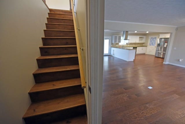 stairs with hardwood / wood-style floors