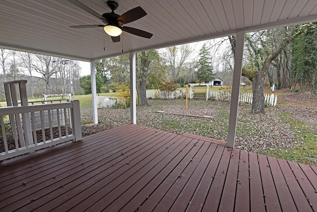 wooden deck featuring ceiling fan